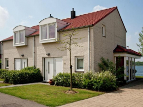 House with garden in a holiday park in Limburg